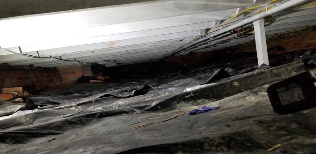 Home crawl space old vapor barrier