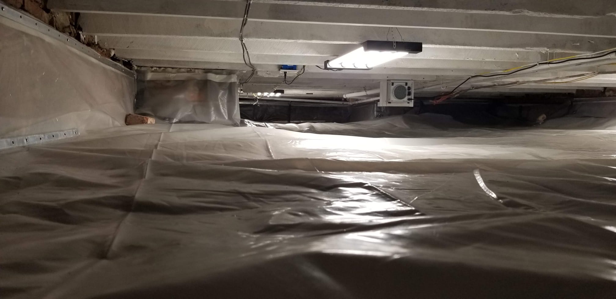 Dehumidifier installed for crawl-space humidity control