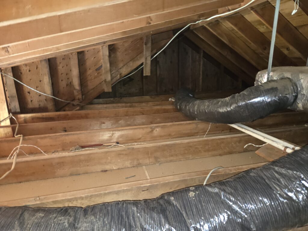 Can You Install New Insulation Over Old Insulation? attic after insulation removal before air sealing