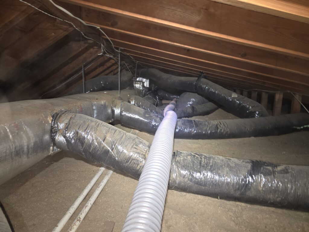 Can You Install New Insulation Over Old Insulation? attic hvac ductwork old cellulose insulation before inspection maryland