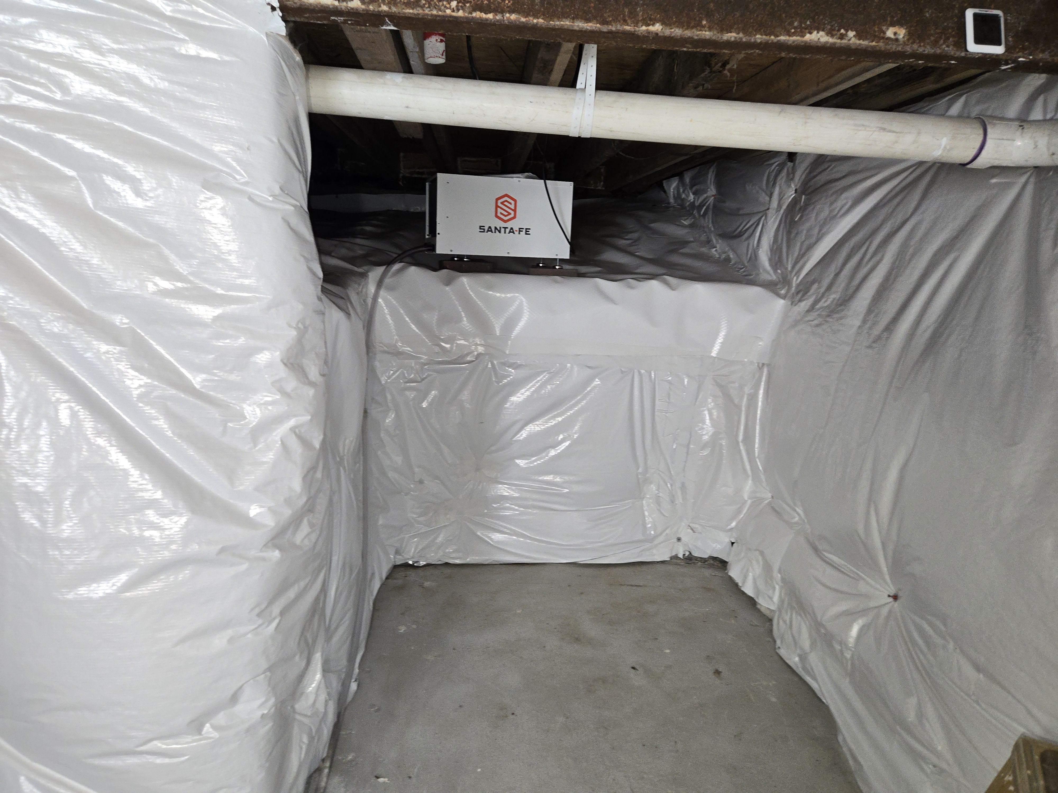 Crawl space dehumidifier installed in an encapsulated Maryland crawl space