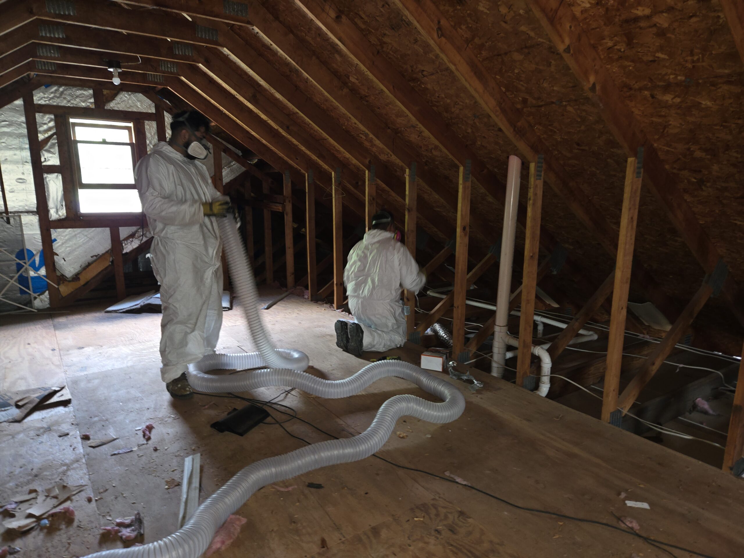Xanvria insulation crew in protective gear working in a Maryland attic